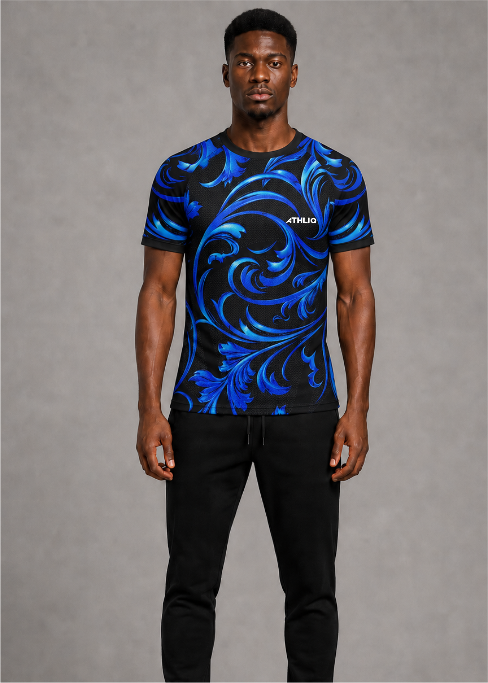 Man wearing a blue and black patterned t-shirt with 'ATHLIQ' branding on a gray background
